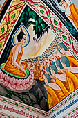 Vientiane, Laos - Pha That Luang, among the Other structures on the ground there is an open sala decorated with brightly colored paintings. 